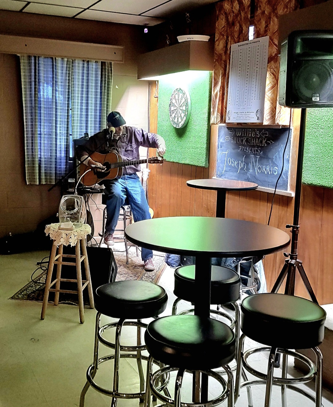 Local musician, Joseph Norris, performing live at The Shuck Shack with an Acoustic Guitar