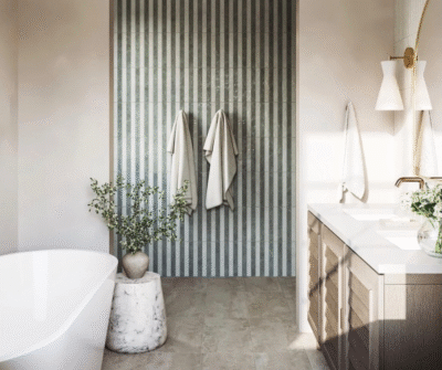 Bathroom featuring organic textures and hand-painted style tiles that add warmth and character to the space.